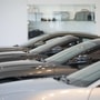 A salesman wearing a protective face mask speaks on a mobile phone at the Aston Martin Works dealership in Newport, UK. (File photo) (Bloomberg)