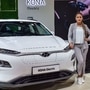 Greater Noida: A model poses next to a Hyundai Kona Electric car displayed at the Auto Expo 2020 in Greater Noida, Wednesday, Feb. 5, 2020. (PTI Photo/Ravi Choudhary) (PTI)