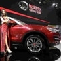 A model poses with Great Wall H7 SUV at the Shanghai International Automobile Industry Exhibition. (File photo)