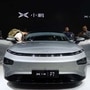 FILE PHOTO: People look at XPeng's P7 sedan model displayed at the Guangzhou auto show in Guangzhou, Guangdong province, China November 22, 2019. (REUTERS)