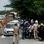 Police personnel check ID cards of commuters at Delhi Noida Border. (file photo)