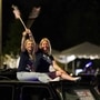 Joe Biden supporters wave American flags while sitting atop their vehicle at a drive-up rally in Delaware. (REUTERS)
