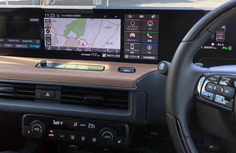 A part of full-width digital dashboard, comprised of five integrated high-resolution color screens, are seen inside a Honda E electric car.