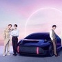 K-pop band BTS members pose with Hyundai Ioniq EV.