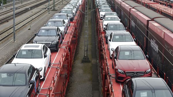 File photo of new Mercedes-Benz cars being transported on railway wagons in Germany. (Bloomberg)