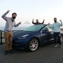 Photo of Alexander Sims with his partners Dean Fielding and David Peilow with the record-breaking Tesla Model 3 car. (Photo courtesy: Twitter/@ZeroCarbonWorld)
