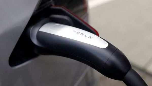 FILE PHOTO: A Tesla car is charged at a super-fast multi-charging power column in Bonn, Germany (REUTERS)