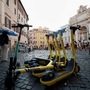 Electric scooters are parked near Trevi Fountain in Rome, Italy on September 18, 2020.  (REUTERS)
