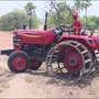 A Mahindra Yuvo tractor in action