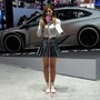 A blogger prepares to record herself during at Beijing Auto Show.The exhibition has already managed to attract a large number of people because of the products on display. (AP)