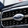 Ford Motor CEO Jim Farley poses next to a new 2021 Ford F-150 pickup truck at the Rouge Complex in Dearborn, Michigan, US (REUTERS)