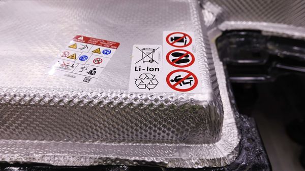 A recycling symbol sits on a lithium-ion battery pack of a Volkswagen e-Golf electric automobile. (Bloomberg)
