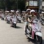 Women police personnel with Pink Patrol vehicles passing from Hazratganj crossing after the Flag off by Uttar Pradesh Governor Anandiben Patel under the Safe City project, a women's safety campaign, in Lucknow on Saturday. (ANI Photo)