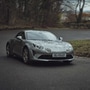 A Renault Alpine A110 sports car in action.