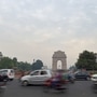 Vehicles drive past India Gate amid hazy weather conditions in New Delhi. (PTI)