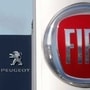 The logos of car manufacturers Fiat and Peugeot are seen in front of dealerships of the companies in France. (File photo) (REUTERS)