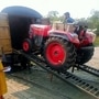A Mahindra tractor being driven into a railway carriage. (Photo courtesy: Twitter handle of Piyush Goyal)