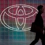 File photo: A Toyota logo appears in the background. (REUTERS)