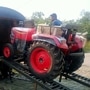 A Mahindra tractor being driven into a railway carriage. (Photo courtesy: Twitter handle of Piyush Goyal)