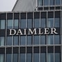 A logo sits beside office windows at the Daimler AG headquarters in Stuttgart, Germany. (File photo) (Bloomberg)
