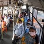Passengers seen sitting next to each other in a bus as Delhi government allows DTC buses to run with full seating capacity.