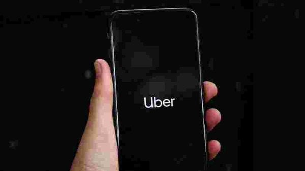 Uber's logo is displayed on a mobile phone. (File Photo) (REUTERS)