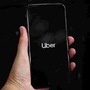 Uber's logo is displayed on a mobile phone. (File Photo) (REUTERS)