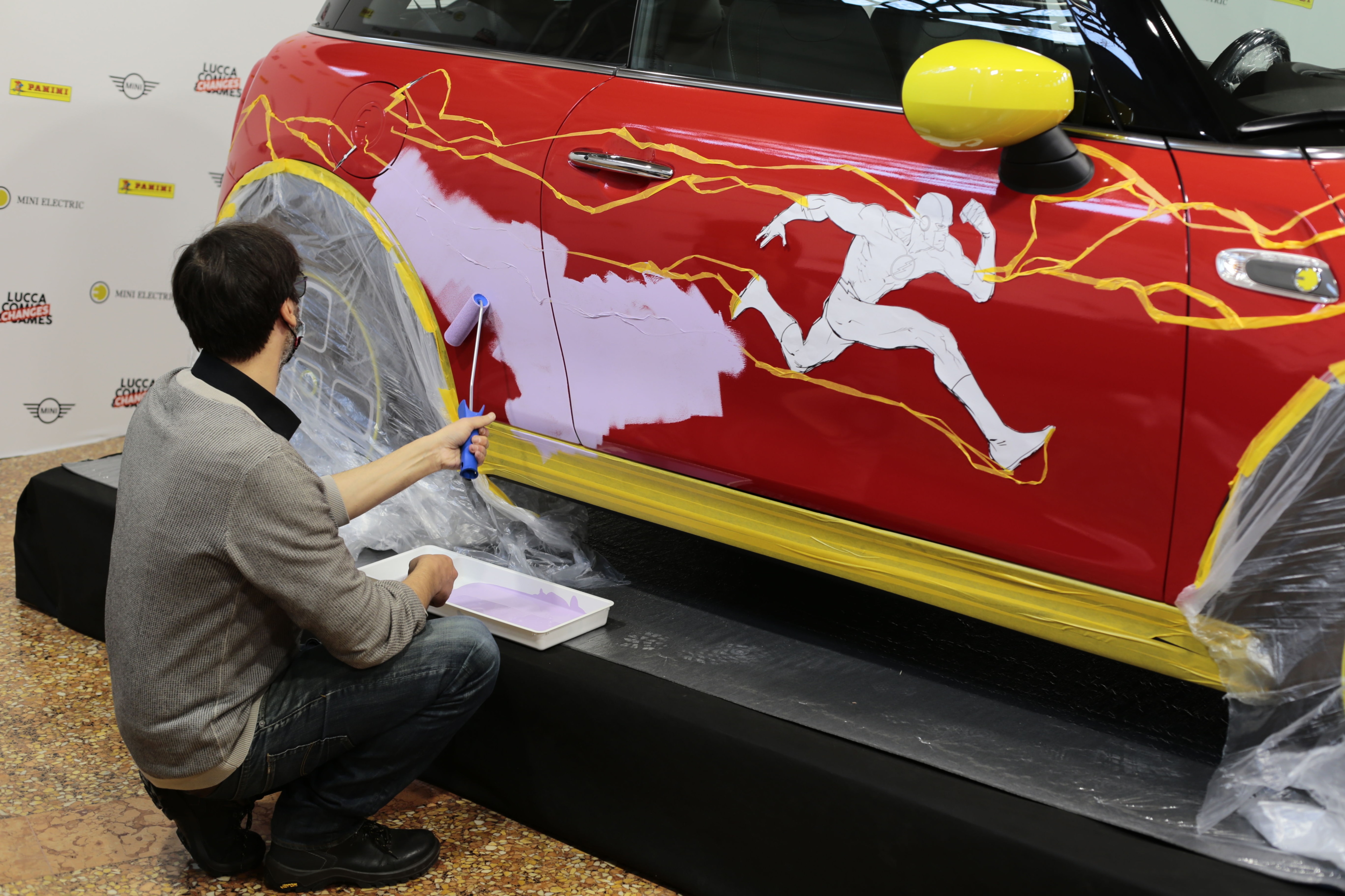 Scarlet Sprinter being painted on Mini Electric