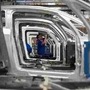 An employee works on the automobile assembly line of Bluecar electric city cars at Renault car maker factory in Dieppe, western France. (REUTERS)