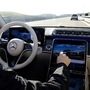An employee of Daimler demonstrates steering by the Drive Pilot Level 3 autonomous driving system in a new Mercedes-Benz S-Class limousine. (File photo) (REUTERS)
