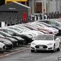 A Tesla Model S electric vehicle drives along a row of occupied superchargers at Tesla's primary vehicle factory in California. (File Photo) (REUTERS)