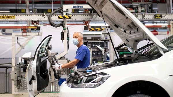 File photo - A worker wears a protective mask at the Volkswagen assembly line in Wolfsburg, Germany. (REUTERS)