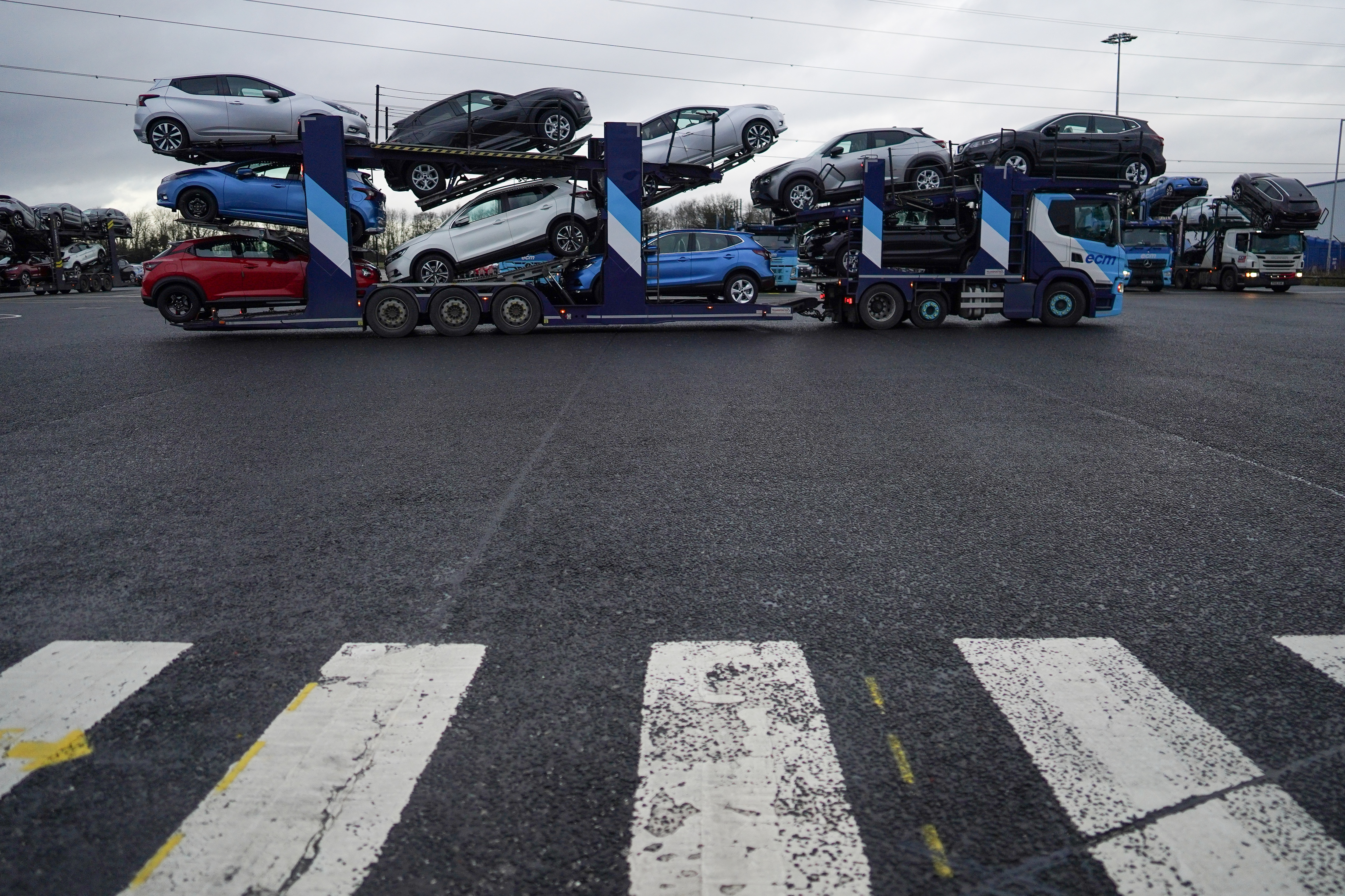 Newly manufactured automobiles leave on a car transporter from the Nissan Motor Co. plant in Sunderland, UK.,