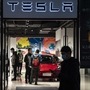 Shoppers stand in a Tesla showroom in Shanghai, China. (File photo) (Bloomberg)