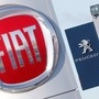 FILE PHOTO: The logos of car manufacturers Fiat and Peugeot are seen in front of dealerships of the companies in Saint-Nazaire, France. (REUTERS)