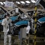 FILE - In this April 8, 2020, file photo, employees work on a car assembly line at the Dongfeng Honda Automobile Co., Ltd factory in Wuhan in central China's Hubei province. China's manufacturing activity weakened in April as the coronavirus pandemic clobbered global consumer demand, hampering Beijing's efforts to revive the world's second-largest economy. (AP Photo/Ng Han Guan, File) (AP)
