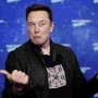 FILE PHOTO: SpaceX owner and Tesla CEO Elon Musk grimaces after arriving on the red carpet for the Axel Springer award, in Berlin, Germany, December 1, 2020. REUTERS/Hannibal Hanschke/Pool (REUTERS)