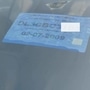 Colour coded sticker on the front windshield. The blue in this image denotes this is a petrol vehicle.
