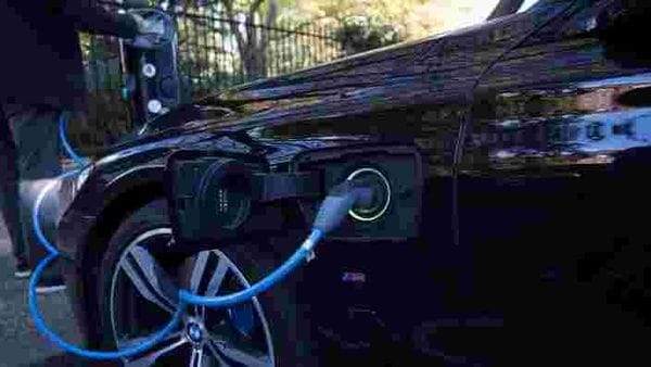 Representational file photo: A driver plugs a cable into a Source power point to charge his electric car. (REUTERS)