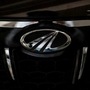 FILE PHOTO: The logo of Mahindra and Mahindra is seen on a car at a showroom in Mumbai, India. (REUTERS)