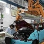 A worker assembles a vehicle on the assembly line at the plant of General Motors in Talegaon. (File photo)