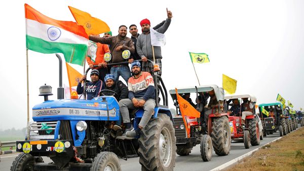 Farmers participate in a tractor rally to protest against the newly passed farm bills. (File Photo)