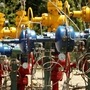 FILE PHOTO: Wellheads painted in the national colours are seen at an oil rig of Ecuador's state oil company Petroamazonas.