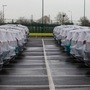 Parked cars covered in protective sheets at Peel Ports Ltd London Medway facility in Sheerness, UK. (Bloomberg)