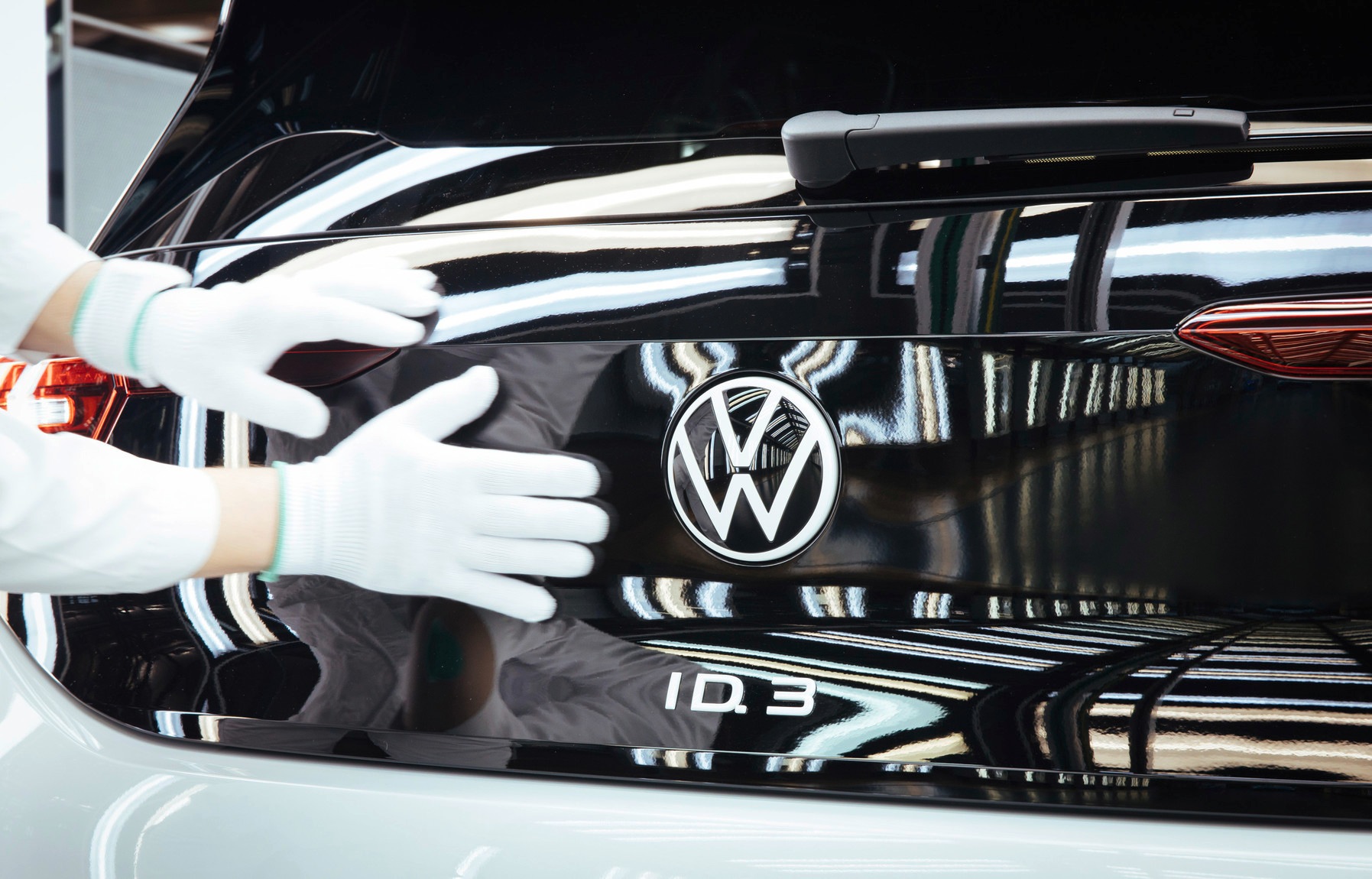 Factory employee working on a Volkswagen ID.3 car Factory employee working on a Volkswagen ID.3 car