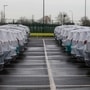 Parked cars covered in protective sheets at Peel Ports Ltd London Medway facility in Sheerness, UK. (Bloomberg)