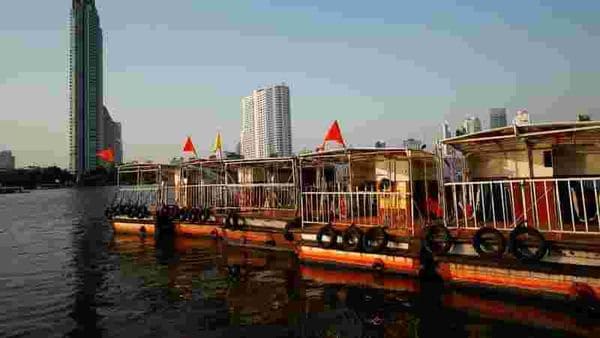 Boats that are used to transport tourists around the Chao Phraya river are seen idle due to travel bans and border closures from the global coronavirus disease