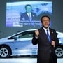 Toyota Motor Corp president Akio Toyoda speaks in front of the company's Prius PHV plug-in hybrid during a news conference at the 42nd Tokyo Motor Show in Tokyo.