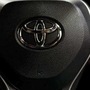 Logos of Toyota (L), Lyft (R)