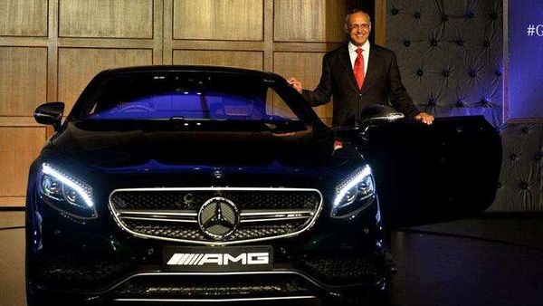 Managing-Director-and-CEO-of-Mercedes-Benz-India-Eberhard-Kern-poses-alongside-a-Mercedes-Benz-AMG-S-63-Coupe-during-a-launch-ceremony-in-New-Delhi-on-July-30-2015-Mercedes-Benz-India-have-launched-three-highly-luxurious-cars-S500-Coupe-AMG-S63-Coupe-and-AMG-G-63-crazy-colour-edition-Photo-AFP